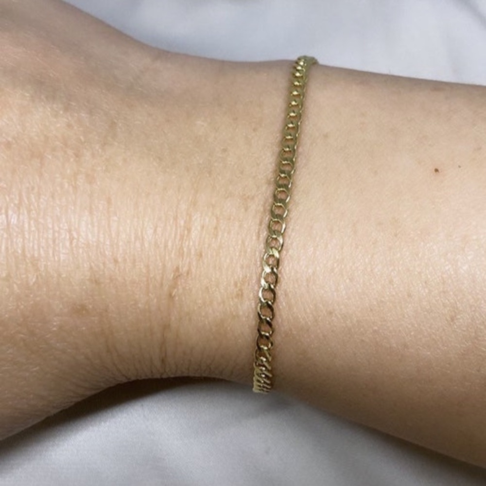 Authentic 10K gold miami link bracelet with lobster lock.